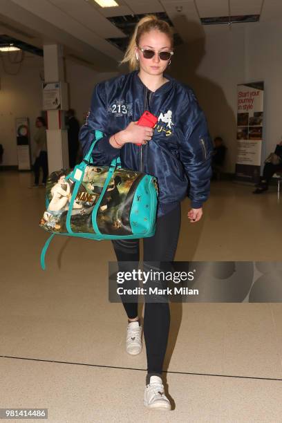 Sophie Turner arriving at Aberdeen Airport facetiming Joe Jonas before the wedding of Kit Harrington and Rose Leslie on June 22, 2018 in Aberdeen,...