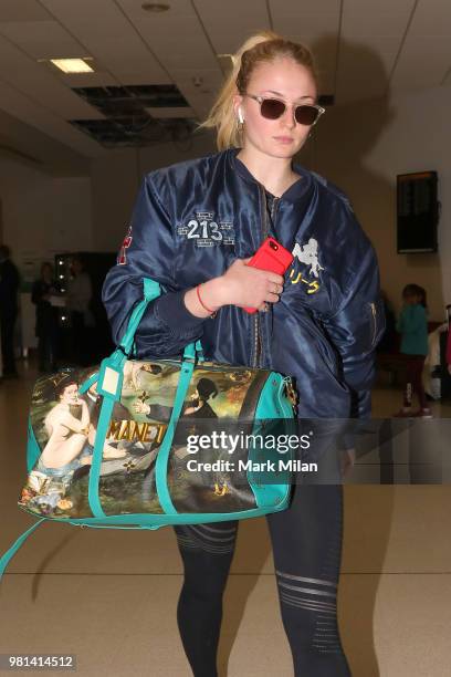 Sophie Turner arriving at Aberdeen Airport facetiming Joe Jonas before the wedding of Kit Harrington and Rose Leslie on June 22, 2018 in Aberdeen,...