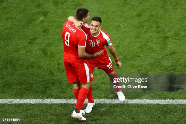 Aleksandar Mitrovic of Serbia celebrates with teammate Dusan Tadic after scoring his team's first goal during the 2018 FIFA World Cup Russia group E...