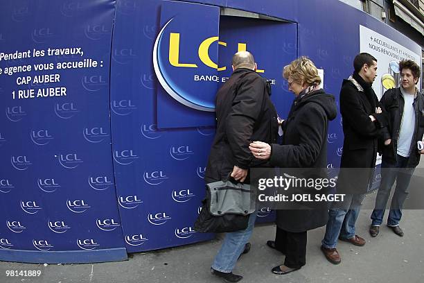 Man enters a French LCL bank agency on March 30, 2010 in Paris, after burglars tunnelled into the bank vault and raided around 100 safety deposit...