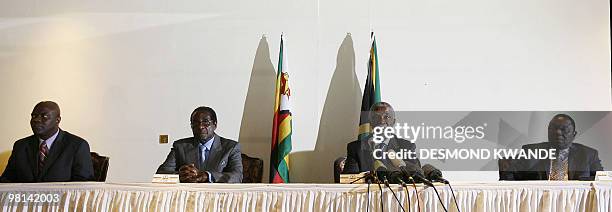 Zimbabwean political leader Arthur Mutambara, President Robert Mugabe, South African President Thabo Mbeki and Zimbawean opposition Movement for...
