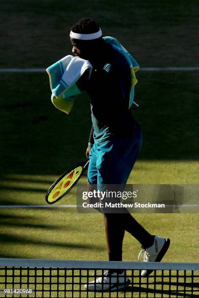 Frances Tiafoe of the United States walks to his chair between games during his men's singles quarterfinal against Jeremy Chardy of France on Day...