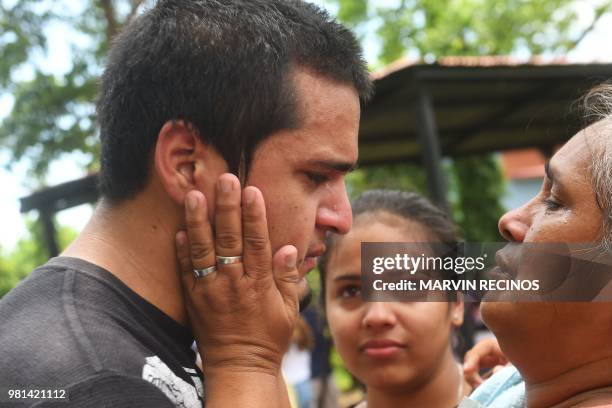 Man -who had been arrested in recent protests- is greeted by a relative after being released from jail in Managua, Nicaragua on June 22, 2018. - Ten...