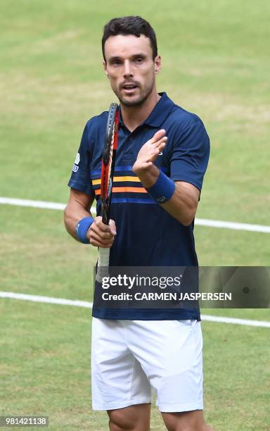 Roberto Bautista Agut from Spain reacts after his match against Karen Khachanov from Russia at the ATP Gerry Weber Open tennis tournament in Halle,...