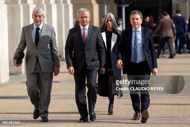 Argentina's Finance Minister Nicolas Dujovne , Chilean Finance Minister Felipe Larrain and Argentina's ambassador to Chile Jose Bordon arrive at La...