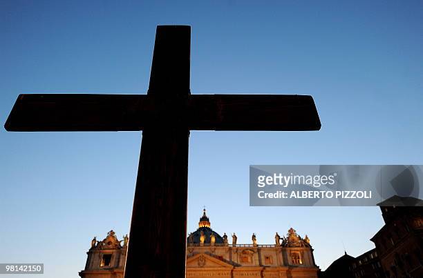 Giant cross is seen in St Peters square at the Vatican on March 25 2010, before the arrival of Pope Benedict XVI for the meeting with the youth of...