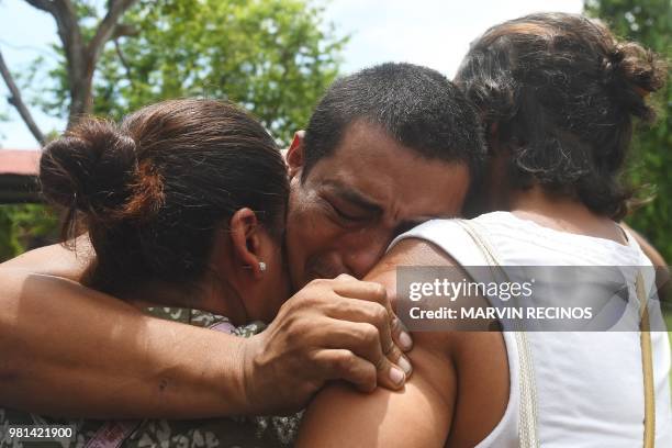 Man -who had been arrested in recent protests- is embraced by relatives after being released from jail in Managua, Nicaragua on June 22, 2018. - Ten...