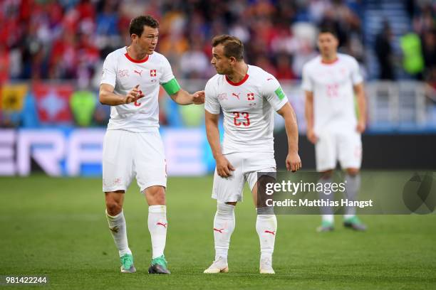 Stephan Lichtsteiner of Switzerland speaks with Xherdan Shaqiri of Switzerland during the 2018 FIFA World Cup Russia group E match between Serbia and...