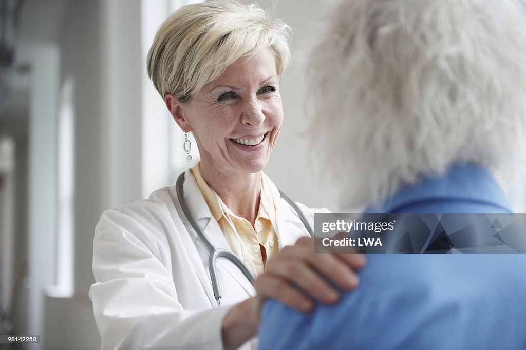 Doctor Speaking To Female Patient