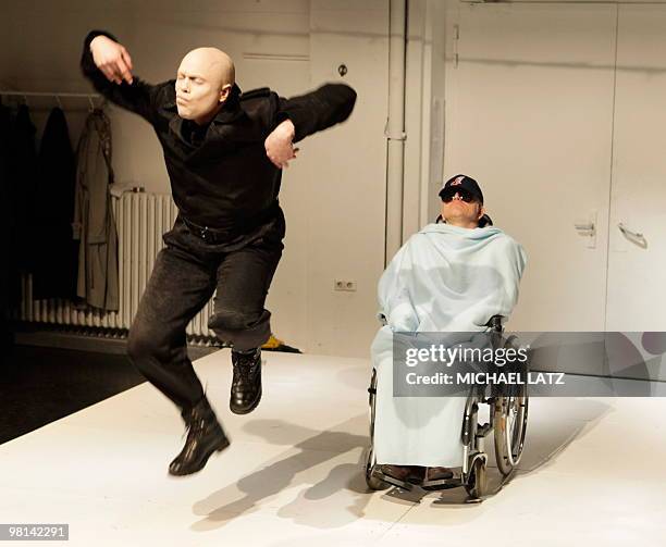 Daniel Stock plays the role of Ivan the terrible and Klaus Colfalka-Adami plays the accused Nazi death camp guard John Demjanjuk on stage during a...