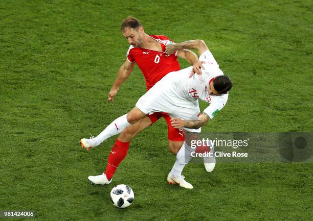 Branislav Ivanovic of Serbia battles for possession with Steven Zuber of Switzerland during the 2018 FIFA World Cup Russia group E match between...