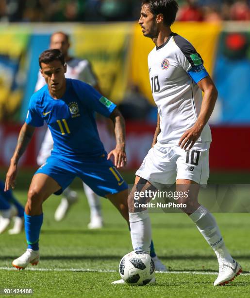 Philippe Coutinho of the Brazil national football team and Bryan Ruiz of the Costa Rica national football team vie for the ball during the 2018 FIFA...