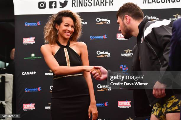 Dave Allen of Great Britain shakes the hand of the ring girl during the weigh-in and press conference at the Temple Noble Art ahead of the fight...