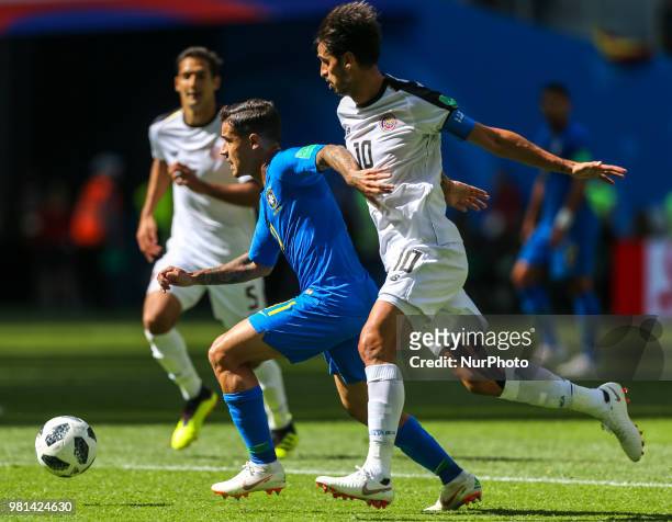 Philippe Coutinho of the Brazil national football team and Bryan Ruiz of the Costa Rica national football team vie for the ball during the 2018 FIFA...