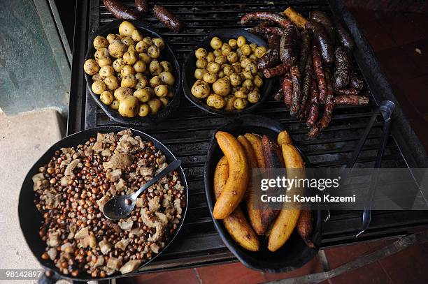 Typical Colombian food, sausages, small potatoes, bananas on grill bar in a city restaurant. Villa de Leyva is a colonial town and municipality, in...