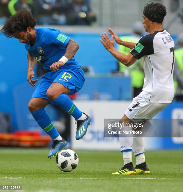 Marcelo of the Brazil national football team and Christian Bolanos of the Costa Rica national football team vie for the ball during the 2018 FIFA...