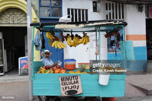 Fresh fruit vendor sits on the corner of main square. Quimbaya is a town and municipality in the western part of the department of Quindío, Colombia....