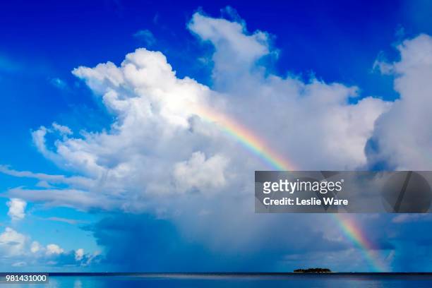 rainbow over island, managaha island, northern mariana islands - northern mariana islands stock-fotos und bilder