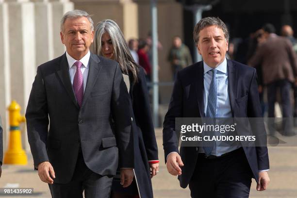 Argentina's Finance Minister Nicolas Dujovne and Chilean Finance Minister Felipe Larrain arrive at La Moneda presidential palace before a meeting...