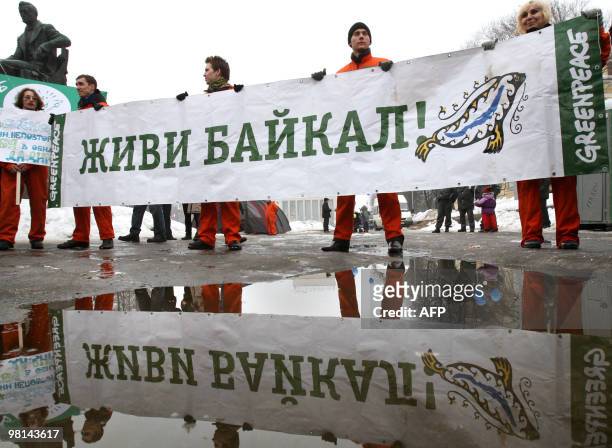 Supporters of the Greenpeace organization hold a rally in defence of Lake Baikal in St. Petersburg on March 27, 2010. Activists protested against the...