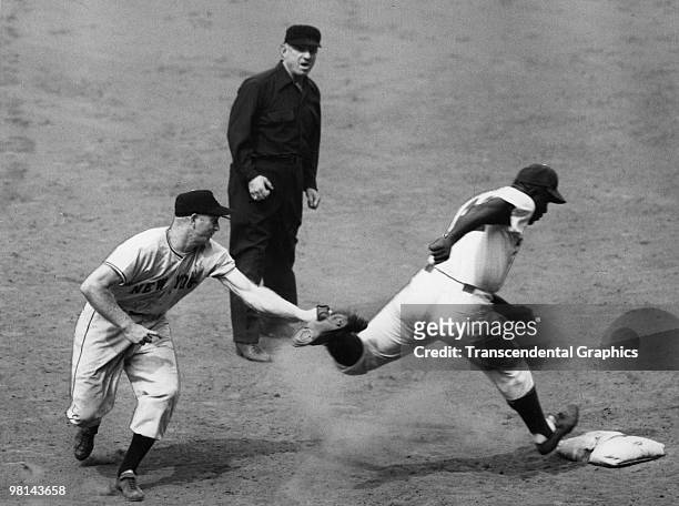 Jackie Robinson is tagged out by New York Giants first baseman Whitey Lockman in a game at Ebbets Field in Brooklyn in 1948.