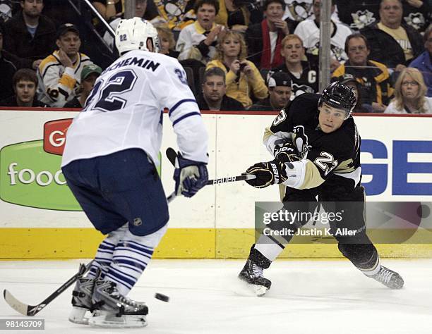 Alexei Ponikarovsky of the Pittsburgh Penguins takes a shot on goal against Francois Beauchemin of the Toronto Maple Leafs at Mellon Arena on March...