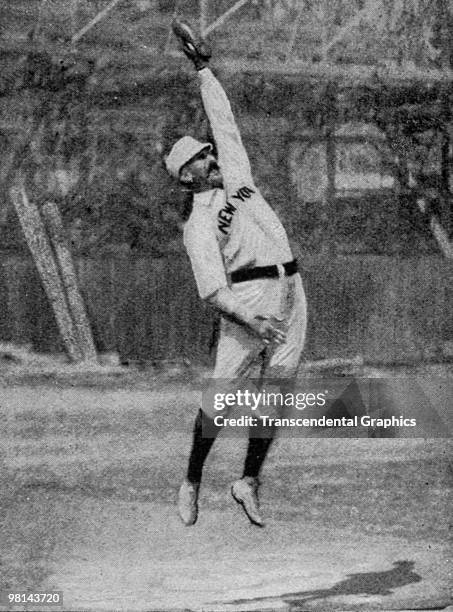 Buck Ewing, Hall of Fame catcher for the New York Giants leaps for a high throw during a practice session with the team in this rare action photo...