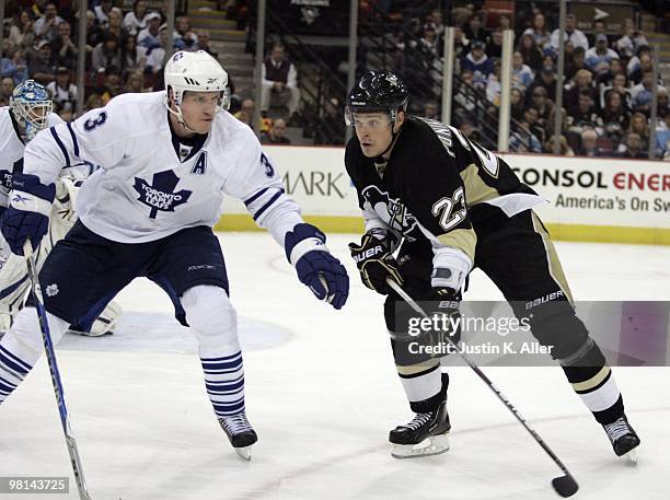 Alexei Ponikarovsky of the Pittsburgh Penguins skates against Dion Phaneuf of the Toronto Maple Leafs at Mellon Arena on March 28, 2010 in...