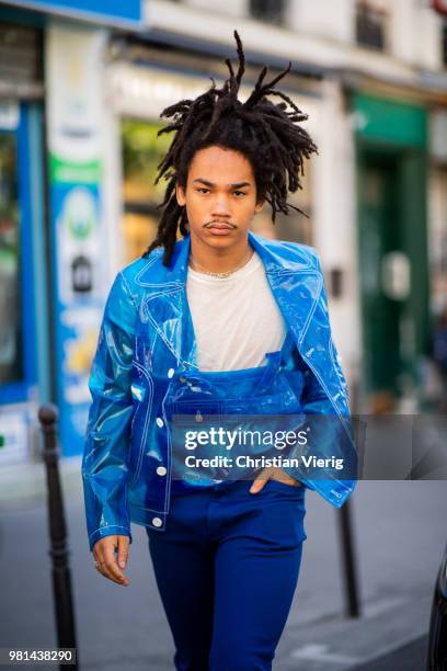 Luka Sabbat wearing blue transparent jacket and overall is seen outside Maison Margiela on day four of Paris Fashion Week Menswear SS19 on June 22,...