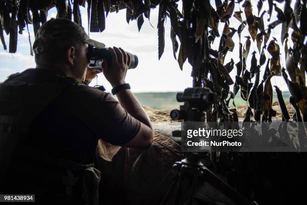 Soldiers of the Ukrainian army on the front line during the Joint Forces Operation in Donbass area, Luhansk region, Ukraine, on June 2018. During the...