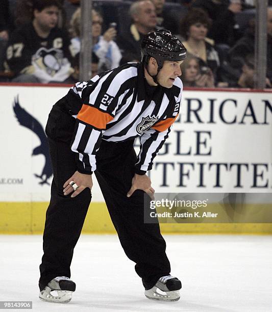 Referee Stephen Walkom prepares for a face-off during play between the Pittsburgh Penguins and the Toronto Maple Leafs at Mellon Arena on March 28,...