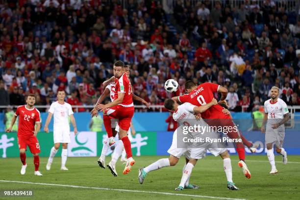 Stephan Lichtsteiner of Switzerland collides with Aleksandar Mitrovic of Serbia inside the penalty area during the 2018 FIFA World Cup Russia group E...