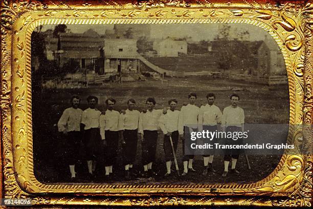 Young man's baseball team posing outdoors near Fremont, Iowa appear on this c.1875 tintype.