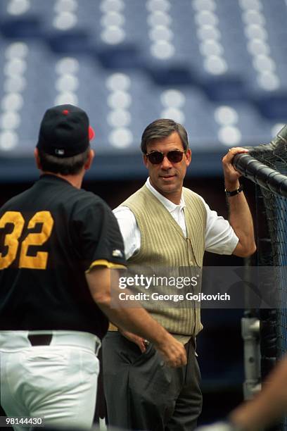 General manager Cam Bonifay of the Pittsburgh Pirates talks with manager Gene Lamont before a Major League Baseball game at Three Rivers Stadium in...