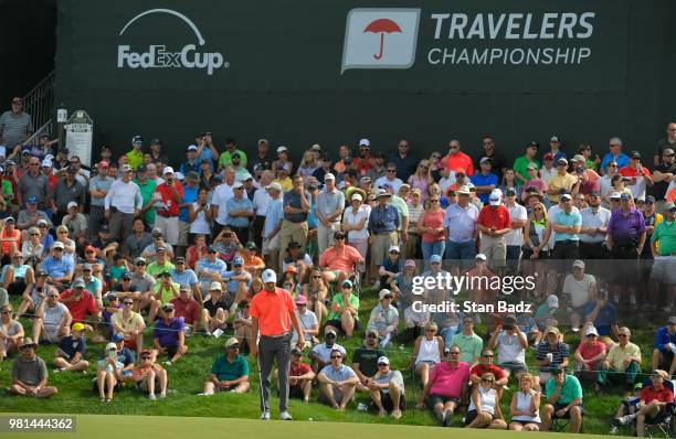 Jordan Spieth lines his putt on the 15th hole during the second round of the Travelers Championship at TPC River Highlands on June 22, 2018 in...