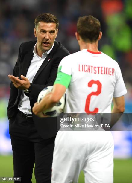 Mladen Krstajic, Head coach of Serbia speaks with Stephan Lichtsteiner of Switzerland during the 2018 FIFA World Cup Russia group E match between...