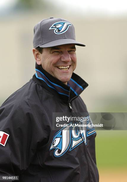 Manager Carlos Tosca watches spring training drills at the Toronto Blue Jays camp in Dunedin, Florida February 27, 2004.