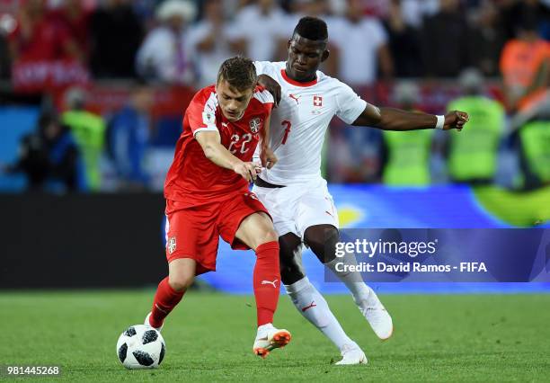 Adem Ljajic of Serbia is challenged by Breel Embolo of Switzerland during the 2018 FIFA World Cup Russia group E match between Serbia and Switzerland...