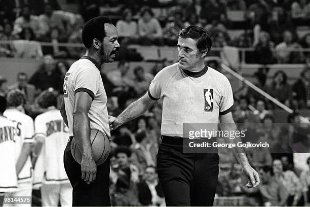 National Basketball Association referees Earl Strom and Hugh Evans talk during a game between the Los Angeles Lakers and Buffalo Braves at the...