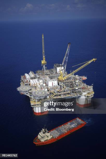 The Kobe Chouest platform supply vessel sits anchored next to the Chevron Corp. Jack/St. Malo deepwater oil platform in the Gulf of Mexico in the...