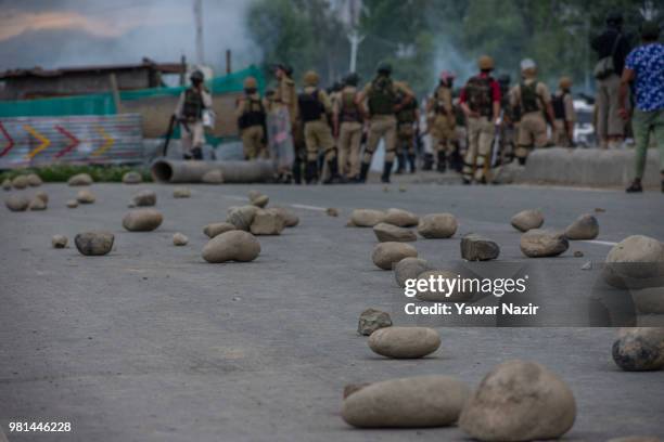 Iddian government forces confront Kashmiri Muslim protesters during a protest on June 22, 2018 in Srinagar, the summer capital of Indian administered...