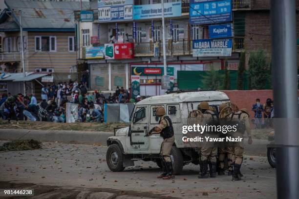 Kashmir protesters save themselves from the live rounds, teargas shells and metal pellets of Indian government forces during a protest on June 22,...