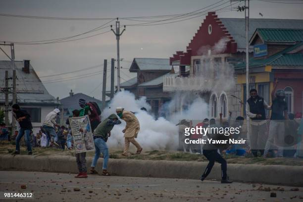 Kashmir protesters save themselves from the live rounds, teargas shells and metal pellets of Indian government forces during a protest on June 22,...