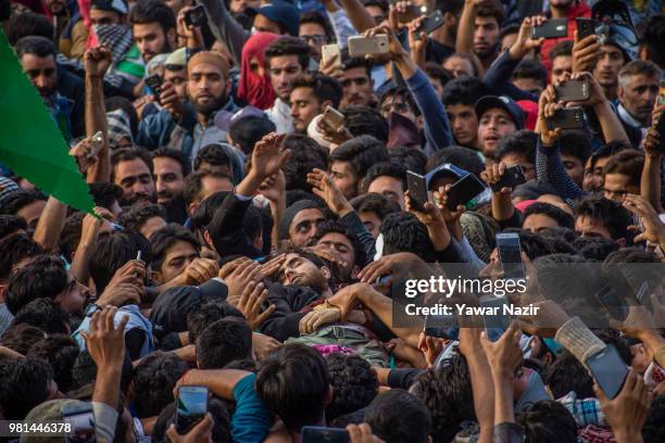 Kashmir Muslims carry the body of Dawood Salafi, a rebel commander killed in a gun battle with Indian government forces during his funeral on June...