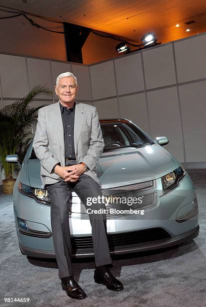 Robert Lutz, vice chairman of General Motors Co., poses with the Chevrolet Volt, a plug-in hybrid due out later this year, in New York, U.S., on...