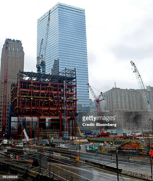 Construction cranes stand near One World Trade Center, formerly known as the Freedom Tower, left, on the site of the former World Trade Center in New...