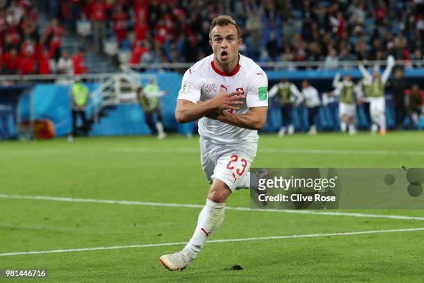 Xherdan Shaqiri of Switzerland celebrates after scoring his team's second goal during the 2018 FIFA World Cup Russia group E match between Serbia and...