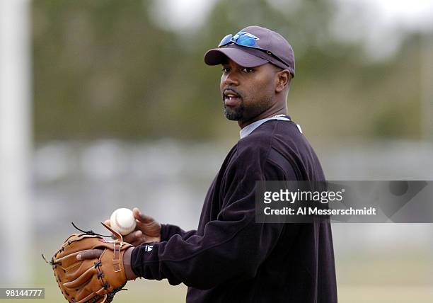 First baseman Carlos Delgado fields a ball during spring training drills at the Toronto Blue Jays camp in Dunedin, Florida February 27, 2004.