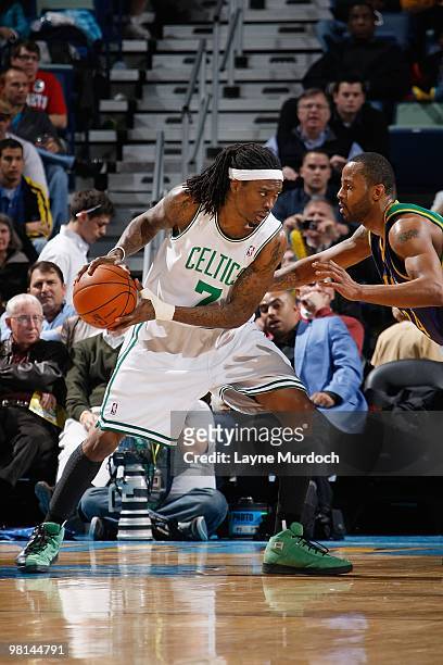 Marquis Daniels of the Boston Celtics handles the ball against Morris Peterson of the New Orleans Hornets during the game on February 10, 2010 at the...