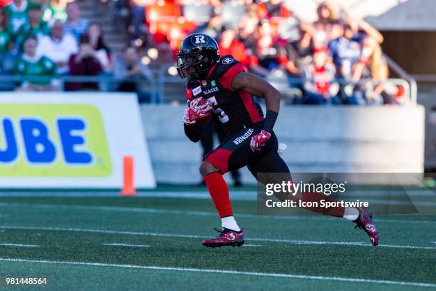 Ottawa RedBlacks defensive back Loucheiz Purifoy runs with the football during Canadian Football League action between Saskatchewan Roughriders and...